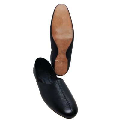 "Black leather men’s traditional slip-on shoe with soft leather sole and cushioned insole, handcrafted in Bangladesh."