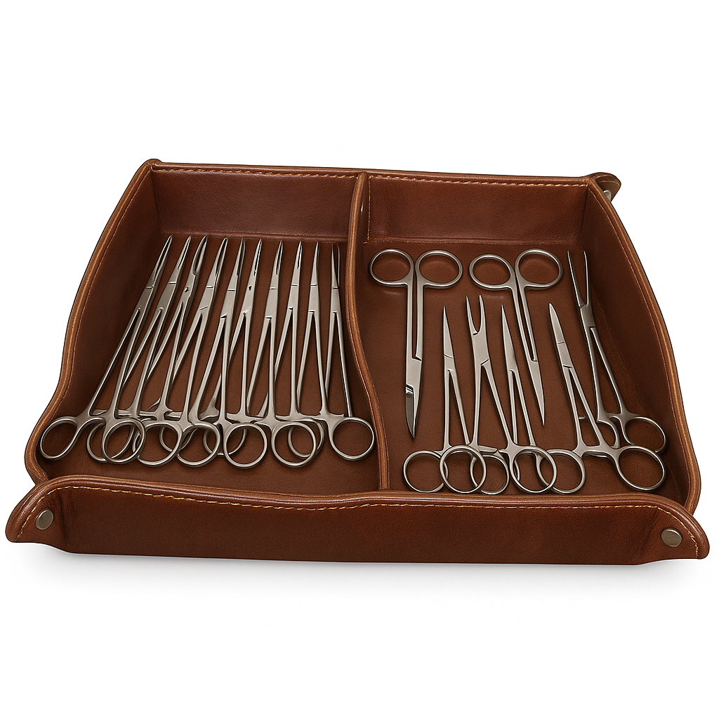 A set of stainless steel surgical scissors and forceps neatly arranged in a brown leather organizer tray.