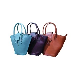 Three premium women’s leather tote bags in blue, maroon, and tan colors displayed side by side.