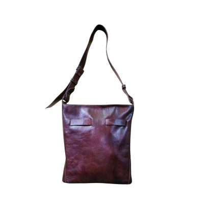 "Minimalist brown women’s leather shoulder bag with adjustable strap and clean front design."
