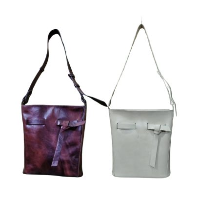 "Women’s leather shoulder bags in brown and off-white with minimalist design and front knot detail."