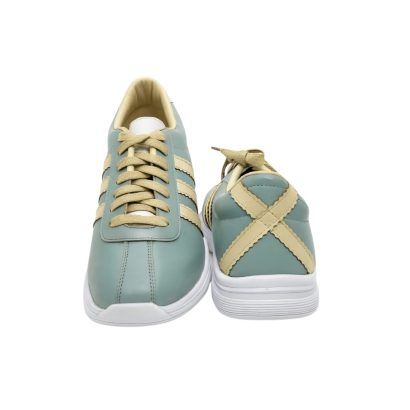 "Front and back view of mint green casual sneakers with cream stripes and X-back design."