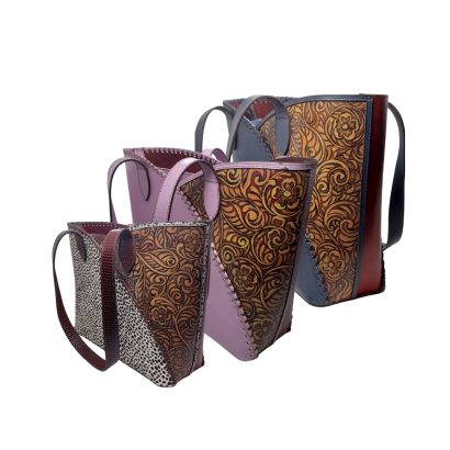 “Handcrafted women’s leather tote bags with floral embossed design and multi-color panels, available in different sizes.”