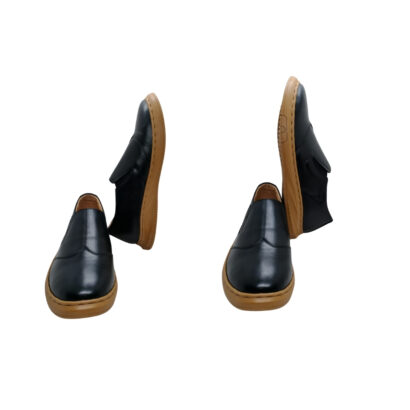 Front and side view of men’s black genuine leather slip-on shoes with durable sole on white background