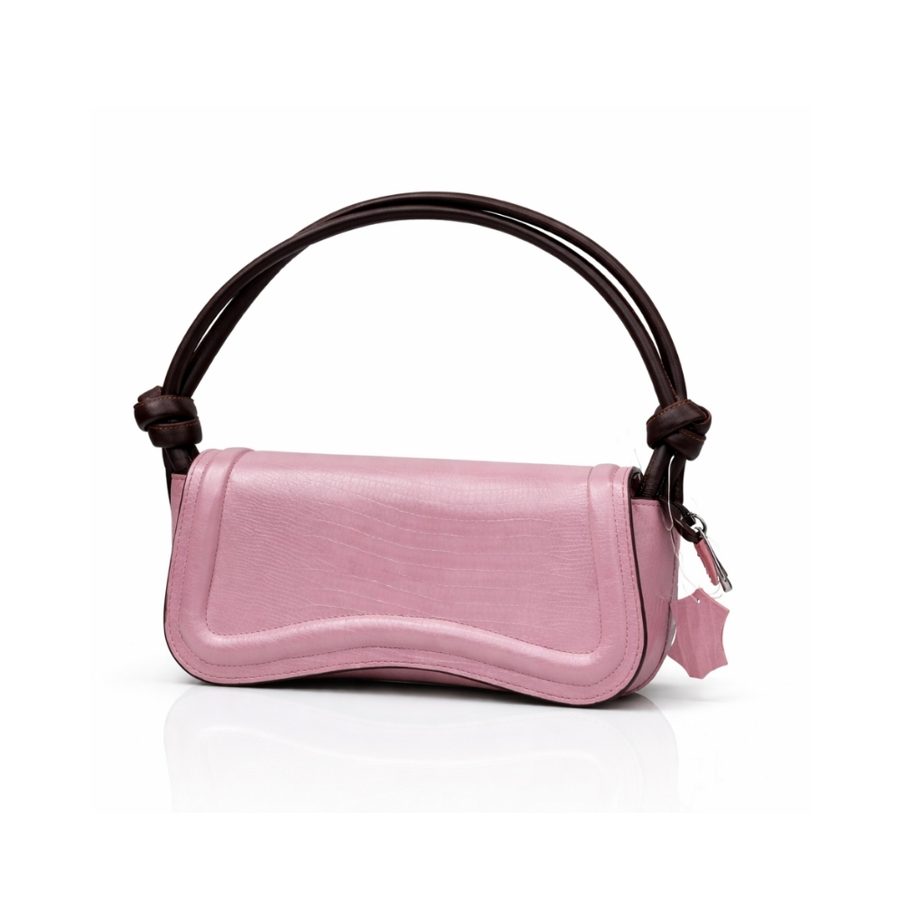 Pink leather shoulder handbag with curved flap and dark brown knotted straps on white background