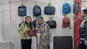 Customer holding a leather handbag at Shabab Leather stall during Kathmandu Business Expo 2026